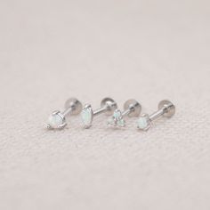 Our opal flat back earrings are dainty and completely waterproof! The 18G flat back design ensures comfort fit, making them ideal for everyday wear as well as special events. - Material: Genuine opal, High quality 925 sterling silver core material, 18 K gold filled, hypoallergenic - Size: Thickness - 18 G/ Length - 8mm  - Qty: sold as 1 piece - Turnaround time: Same day or Next day delivery guaranteed - Packed in gift jewelry box - Please ask me any questions ! I am quick to reply :) Thank you for visiting my shop - For shop policies, please visit: https://www.etsy.com/shop/DoodleJewelrybyDKArt Nickel-free White Sterling Silver Piercings, Dainty Nickel-free Silver Nose Studs, White Dainty Cartilage Earrings For Gift, Dainty White Cartilage Earrings For Gift, Dainty White Cartilage Earrings As Gift, Dainty Internally Threaded Nose Studs As Gift, Hypoallergenic White Gold Nose Studs As Gift, Nickel Free White Piercings As Gift, Nickel-free White Piercings As A Gift