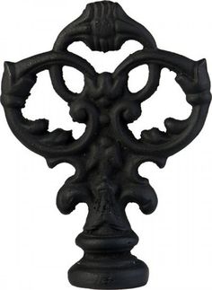 an ornate black iron door handle on a white background