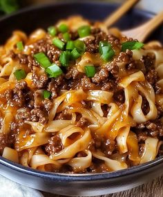 a bowl filled with noodles and ground beef