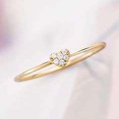 Made of solid 14k gold (not plated, not filled, not vermeil), this ring is available in your choice of yellow, white, or rose gold Featuring heart motif set with delicate diamond pavé, this cutie adds just a touch of sparkle to any look and makes a wonderful gift, delivered in a gift box! Delicate and dainty, this ring is easy to style and perfect for stacking! Metal: 14K Solid Gold Diamonds: 0.03ctw (G color, VS clarity) Heart Dimensions: 4.0mm x 3.5mm Shank: 1.0mm This item typically ships within 1-10 business days. However, during periods of increased order volume, please allow up to 3 weeks for item to ship. For rush order requests and immediate availability, please message shop directly prior to purchase. Gift box included. Please note that all sales are final and not eligible for ret Dainty Yellow Gold Heart Ring With Diamond Accents, Dainty Yellow Gold Diamond Ring For Valentine's Day, Glen Cove, Diamond Heart Ring, Heart Motif, Natural Gifts, Diamond Heart, Yellow Roses, Yellow Rose