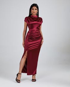 Feel like a total queen in this regal Burgundy High Neck Split Maxi Dress! Flattering on any body type, you'll love its silky fabric and beautiful deep hue. Stylish split detailing and a high neckline make for a swoon-worthy look. Ready to be the belle of the ball? Get this dress today! Our Style No.ZZC Height - 66.9"/170cm Bust - 33.8"/86cm Waist - 24.4"/62cm Hips - 36.2"/92cm and wears size S About Wholesale/Dropshipping, please contact us! Note: Colour may vary due to lighting on images. The Solid Ruched High Neck Dress, Evening Satin High Neck Maxi Dress, High Neck Satin Maxi Dress For Party, High Neck Satin Dress For Date Night, High Neck Satin Evening Dress, Satin High Neck Dress For Date Night, Chic High Neck Satin Maxi Dress, Chic High-neck Satin Maxi Dress, High Neck Satin Dress For Formal Occasions