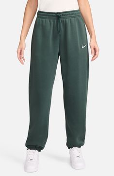 These midweight sweatpants are made of a brushed cotton-blend fleece to keep you feeling cozy no matter where the day takes you. 29 1/2" inseam; 11" leg opening; 12" front rise; 16 1/2" back rise (size Medium) Elastic/drawstring waist Side-seam pockets 80% cotton, 20% polyester Machine wash, tumble dry Imported Nike Phoenix Fleece, Oversized Joggers, Cosy Vibes, Oversized Sweatpants, Luxury Loungewear, Athletic Clothing, Nike Sweatpants, Loungewear Luxury, Fleece Sweatpants