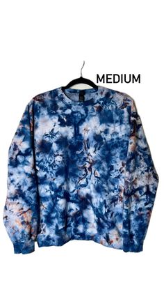 a blue and white tie dye sweatshirt with the word medium on it