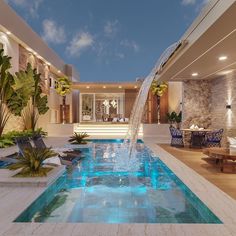 an indoor swimming pool surrounded by greenery and blue water features a waterfall running down the side