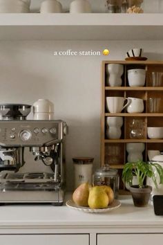 the coffee station is full of cups, bowls, and other kitchen items on display