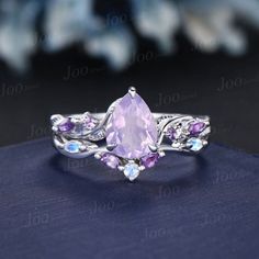 an amethorate ring with purple stones on it