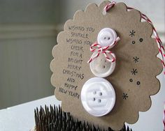 a couple of buttons sitting on top of a card