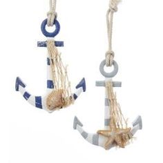 two blue and white anchor ornaments hanging from ropes