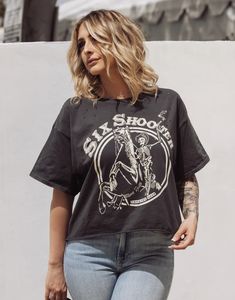 Six Shooter OVERSIZED 90's vibe distressed Cropped T- shirt available in faded black Model is 5ft 4 wearing a size Small This Crop Jersey Tee slides right into streetwear style for Summer and Winter.. With oversized sleeves and a relaxed body, this on-trend tee drops a little lower in the back for an effortlessly cool feel. Fabricated from ultra-soft, lightweight Airlume cotton that's fit to flatter, this looser crop features a finished hem and neck binding.Features: Finished hem. Oversized slee Spring Grunge T-shirt For Alternative Fashion, Edgy Washed Black T-shirt With Letter Print, Urban Style Washed Black Summer Tops, Trendy Acid Wash T-shirt For Concert, Edgy Acid Wash Short Sleeve T-shirt, Edgy Acid Wash T-shirt For Alternative Fashion, Edgy Washed Black T-shirt For Spring, Black Washed T-shirt For Fall, Edgy Distressed Crew Neck T-shirt