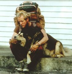 a man sitting on the steps with his dog in front of him and text that reads, the best things in life aren't