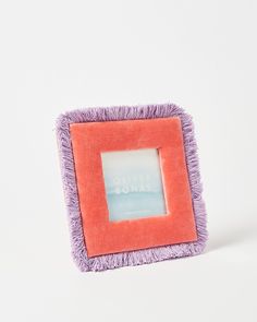 an orange and purple square frame with the words silver bonki on it in front of a white background