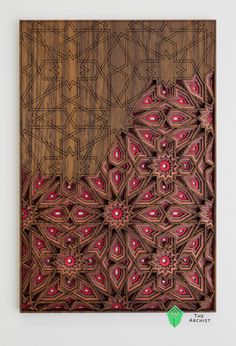 an art piece made out of wood with red and brown designs