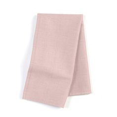 a pink napkin on a white background