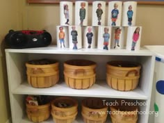 the shelves are filled with wooden baskets and cards for children's birthday party favors