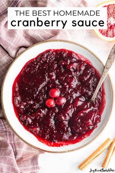 the best homemade cranberry sauce in a bowl with cinnamon sticks and grapefruit