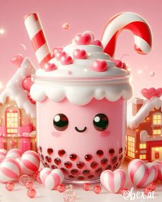 a pink cup with candy canes and candies around it