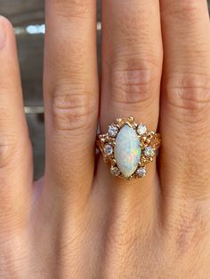 Total Weight: 8.2 grams Size: 5.75 Band Width: 2.4-17.8mm Opal: 16x6.6mm Diamonds: 2.2mm Condition: In great condition showing little wear with no damage. All gold has been thoroughly checked with an Olympus XRF spectrometer. It is guaranteed 14k gold.  All our jewelry is properly washed and disinfected to ensure customers get clean items with every order.  Returns accepted but may be subjected to a restock fee.  Please message with any questions:) Opal Diamond Ring, Jewelry Real, Multi Stone Ring, Multi Stone, Estate Jewelry, Stone Rings, Halloween Shopping, Diamond Ring, Jewelry Rings