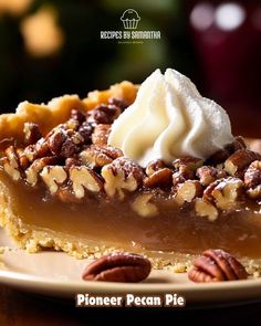 a piece of pecan pie with whipped cream on top is sitting on a plate