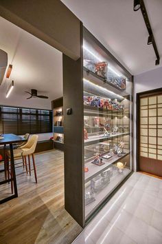 a glass display case in the middle of a room