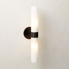 a black and white light fixture on a wall