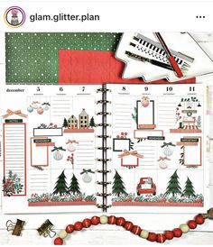 an open planner with christmas decorations on it