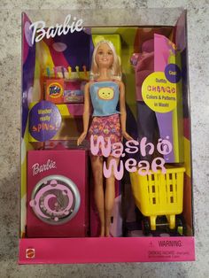 the barbie doll is wearing a dress and has a shopping cart