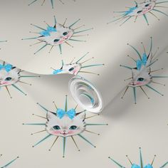 a white cat with blue eyes and spikes on it's face is shown in this wallpaper