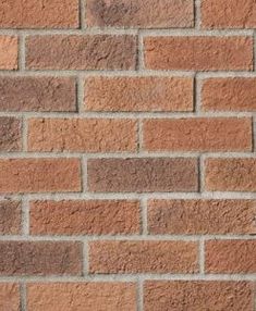 a brick wall with no mortar or mortars on the top and bottom part, in brown