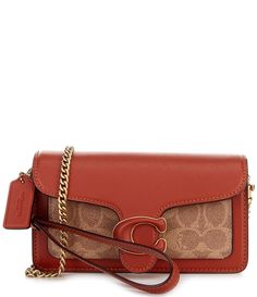 From COACH&#x2C; the Tabby Wristlet Signature Coated Canvas Convertible Wristlet Crossbody Bag features:Signature coated canvas and Glove tanned leatherFabric liningTwo credit card slots Inside multifunction pocketPush lock closureOutside open pocketDetachable wrist strapDetachable shoulder/crossbody chain strap with approx. 23" DApprox.: 7.25" L x 4.25" H x 1.25" WImported. Coach Tabby Wristlet, Coach Crossbody Wallet For Travel, Coach Leather Crossbody Wallet On Chain, Coach Rectangular Chain Wallet With Detachable Strap, Coach Crossbody Wallet With Detachable Strap, Coach Wallet On Chain For Everyday Use, Coach Wallet On Chain With Detachable Strap, Coach Luxury Crossbody Wallet On Chain, Luxury Coach Wallet On Chain Crossbody