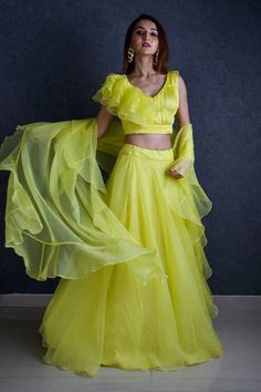 Lemon green organza lehenga. Paired with a pleated, padded and ruffle panel blouse with dupatta. - Aza Fashions Organza Tiered Lehenga For Party, Sleeveless Ruffled Party Sets, Anarkali Style Organza Sets With Ruffles, Fitted Organza Dress For Navratri, Sleeveless Ruffle Party Set, Anarkali Gown With Ruffles For Parties, Fitted Organza Sharara With Ruffles, Party Gown With Ruffles In Georgette, Organza Lehenga With Tiered Skirt For Party