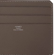 Guaranteed authentic Hermes 8CC Card Holder featured in Etoupe with White Topstitch.As part of the City line of cardholders, it is compact and lightweight.There are 8 slots for business and or credit cards inside.Neutral and beautiful in Evercolor calfskin.Comes with signature Hermes box.New or Store Fresh Condition. final saleCARD HOLDER MEASURES:LENGTH 4.7" TALL 3.3"CONDITION:New or Store Fresh Condition TIDS 'n BITSLightweight and slim, whether vertical or horizontal, this card holder is perf Luxury Brown Card Holder With Coin Pocket, Luxury Brown Wallet With Interior Card Slots, Luxury Brown Trifold Wallet With Interior Card Slots, Luxury Business Wallets With Card Slots, Luxury Compact Trifold Wallet With Card Slots, Luxury Leather Card Holder With Card Slots, Luxury Leather Card Holder With Slots, Classic Compact Card Holder, Luxury Trifold Wallet With Card Slots