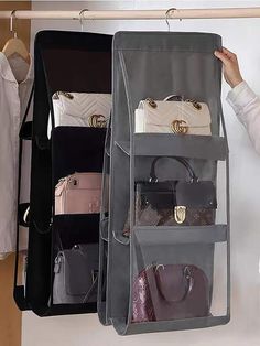 a woman is looking at her purses hanging on a rack in front of an american flag