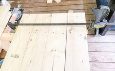 the tools are laying on top of the wood planks and ready to be sanded