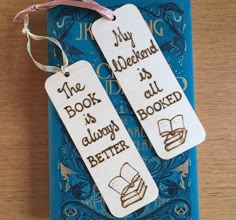 two bookmarks with the words, my book is always all better written on them