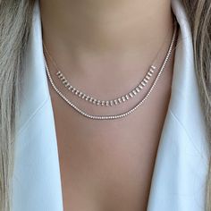 The mini version of our popular 14K gold tribal baguette drop diamond necklace. It offers an eye-catching look that will elevate any outfit. Handcrafted to ensure exceptional quality, this necklace features a unique combination of baguette and round diamonds, set in a tribal design that will add character and sparkle to any look. The luminous baguette diamonds capture the light beautifully, making it an elegant piece that is sure to become a timeless keepsake. Item Information Metal: 14k Gold We Luxury Elegant Jewelry With Baguette Diamonds, Luxury Minimalist Jewelry With Baguette Diamonds, Luxury Evening Jewelry With Baguette Diamonds, Luxury Baguette Diamond Wedding Necklaces, Luxury Evening Diamond Necklace With Baguette Diamonds, Luxury Evening Baguette Diamond Necklaces, Luxury Delicate Baguette Cut Jewelry, Luxury Baguette Diamond Fine Jewelry Necklace, Luxury Baguette Diamond Anniversary Necklace