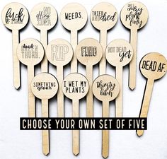 wooden spoons with words on them that say, choose your own set of five