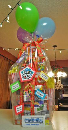 a basket filled with lots of candy and balloons