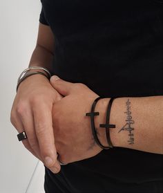 "Mens jet black cross bracelet, glossy black stainless steel unisex cross cuff, fathers gift, boyfriendgift, mens rockstyle black bracelet Welcome to my shop! ✈️ DHL EXPRESS SHIPPING AVAILABLE, 1-3 BUSINESS DAYS DELIVERY! ✔️ PLEASE MAKE SURE TO SELECT IT, RIGHT BEFORE YOUR PURCHASE! ❗️ ❗️ DON'T FORGET TO ADD YOUR CELL # AT THE \"NOTE TO SELLER\" SECTION IF YOU CHOOSE DHL! BY FILLING YOUR CELL NUMBER YOU EARN THE BENEFIT TO CHOOSE BETWEEN 6 DIFFERENT DELIVERY OPTIONS! INSTRUCTIONS WILL BE SENT TO Black Edgy Bracelets As Gift, Edgy Black Cuff Bracelet For Concerts, Edgy Bracelet With Black Band As Gift, Edgy Black Band Bracelet As Gift, Edgy Black Band Bracelet For Gift, Punk Style Black Cuff Bracelet Gift, Edgy Black Wristband For Concerts, Edgy Black Leather Bracelet Gift, Edgy Black Party Wristband