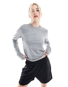 Tops by Nike Running Hit that new PB Crew neck Nike logo print to chest Zip pocket Reflective details for increased visibility in low lighting Thumbhole cuffs prevent sleeves from riding up Regular fit Athleisure Gray Tops With Ribbed Cuffs, Gray Athleisure Tops With Ribbed Cuffs, Sporty Heather Grey Long Sleeve Activewear, Heather Grey Long Sleeve Sporty Activewear, Moisture-wicking Gray Tops For Fall, Gray Moisture-wicking Tops For Fall, Sports Tops With Long Sleeves And Ribbed Cuffs, Long Sleeve Sports Tops With Ribbed Cuffs, Heather Grey Long Sleeve Athleisure Activewear