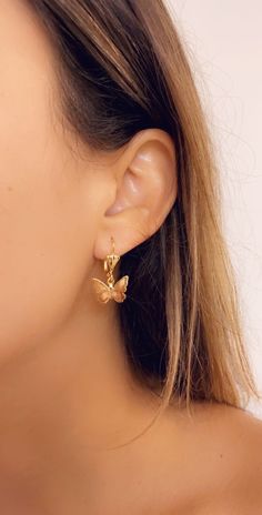 This Summer's must-have piece. Grab a pair of these dainty, trendy and minimalist Butterfly hoops. Material: 18KT Gold Filled Earring Drop is approximately 15mm. Proper Care for your new MaLiBeads: Gold Filled products are durable; however, please remember to apply beauty products such as perfume, hairspray or deodorant before wearing your jewelry as certain chemicals in these products may damage the finish. Always remove your jewelry before swimming, bathing, doing household chores or using abr Elegant Butterfly Earrings For Everyday Wear, Elegant Butterfly Earrings For Everyday, Dainty Butterfly Charm Earrings, Elegant Everyday Butterfly Earrings, Trendy Butterfly Hoop Earrings As Gift, Dainty Hoop Earrings With Butterfly Charm, Dainty Butterfly Earrings For Everyday Wear, Minimalist Butterfly Earrings For Everyday Wear, Minimalist Butterfly Earrings For Everyday