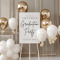 a graduation party sign surrounded by balloons and streamers in front of a gold frame