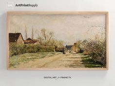 a painting hanging on the wall above a dirt road with houses and trees in the background