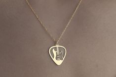 Custom Electric Guitar Necklace 925 Sterling Silver, Guitar Jewelry, Musician Necklace, Guitarist Gift, Personalized Jewelry, Rock Guitar TO OUR VALUED CUSTOMERS ! Please take a look at our special catalog that we have prepared for you ! ▶ https://www.etsy.com/shop/MarryMinimalist ✔️ All products in our unique store are personalized. ( You can find our font list in the images ) D E T A I L S ✔️A lifetime silver CLEANING CLOTH is given as a GIFT along with the 925 Sterling Silver Necklace! ✔️ * Made to Order. * Handmade with Sterling %100 925K Sterling Solid Silver. * Choice of Gold Color: Gold, Rose Gold, Silver * Length: 14", 16", 18", 20", 22" * Ready to Ship in 1-3 Business Days * Free returns within 14 days from the order date. ✔️ 24/7 Friendly Customer Service, contact us for any ques Guitar Necklace, Guitar Jewelry, Silver Guitar, Guitarist Gifts, Silver Cleaning, Custom Electric Guitars, Rock Guitar, Love Gifts, Cleaning Cloth