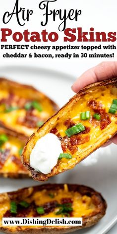 a person holding up a piece of bread with cheese and green onions on it, in front of the text air fryer potato skins