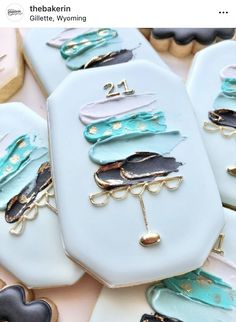 decorated cookies with blue and black designs on them