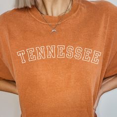 Get ready to fall in LOVE with your new Tennessee comfort colors t-shirt. It's the cutest and most comfortable way to wear the latest styles, and also makes a great gift.  * PRODUCT DETAILS * ✺ 100% Cotton ✺ Medium weight fabric  ✺ Wash and dry normally (on cool for best results) ✺ Designed and printed in the USA ✺ Due to different monitor screens, colors may vary ✺ * SIZING * ✺ FOR AN OVERSIZED FIT, SELECT TWO OR THREE SIZES UP FROM YOUR NORMAL SIZE ✺ ✺ Sizing is unisex ✺ Size guide: Please con University Of Tennessee Shirts, Oversized School Spirit T-shirt With Letter Print, Oversized Fall T-shirt For College, Oversized Fall College Style T-shirt, Oversized College Style T-shirt For Fall, Fall Collegiate T-shirt With Text Print, Oversized Collegiate Short Sleeve T-shirt, College Style Text Print T-shirt For Fall, Collegiate Cotton T-shirt With Slogan