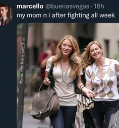 two beautiful young women walking down a street holding shopping bags and smiling at the camera