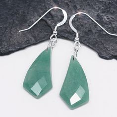 These ultra long earrings are made from beautiful soft mint green Aventurine.  The 5/8" x 1 1/8"  gemstones are highly polished and dangle from sterling silver ear wires. The earrings are approximately 2" in length and are shipped gift boxed on a jewelry card with gemstones and metal used. Soft Mint Green, Soft Mint, Jewelry Card, Fresh Mint, Green Aventurine, Long Earrings, Sterling Silber, Ear Wires, Mint Green