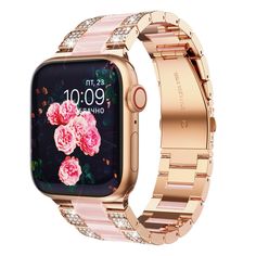 an apple watch with pink flowers on the front and rose - gold bracelets around it