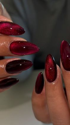 cherry cateye 🍒 #gelx #gelxnails #apres #apresgelx #nailinspo #gelxtech #naildesign #gelnails #nailart #nailsofinstagram #ontarionails #riversidenails #ranchocucamonganails #almondnails #rednails #cateyenails #cherrynails #blacknails #fallnails" New Year Nails Almond Shape, Red Nails Metallic, Win Red Nails, Cherry Coke Nails Chrome, Red Almond Nails Acrylic, Dark Red Shiny Nails, Nail Cherry Red, Almond Nails Designs Dark Red, Red Galaxy Nails